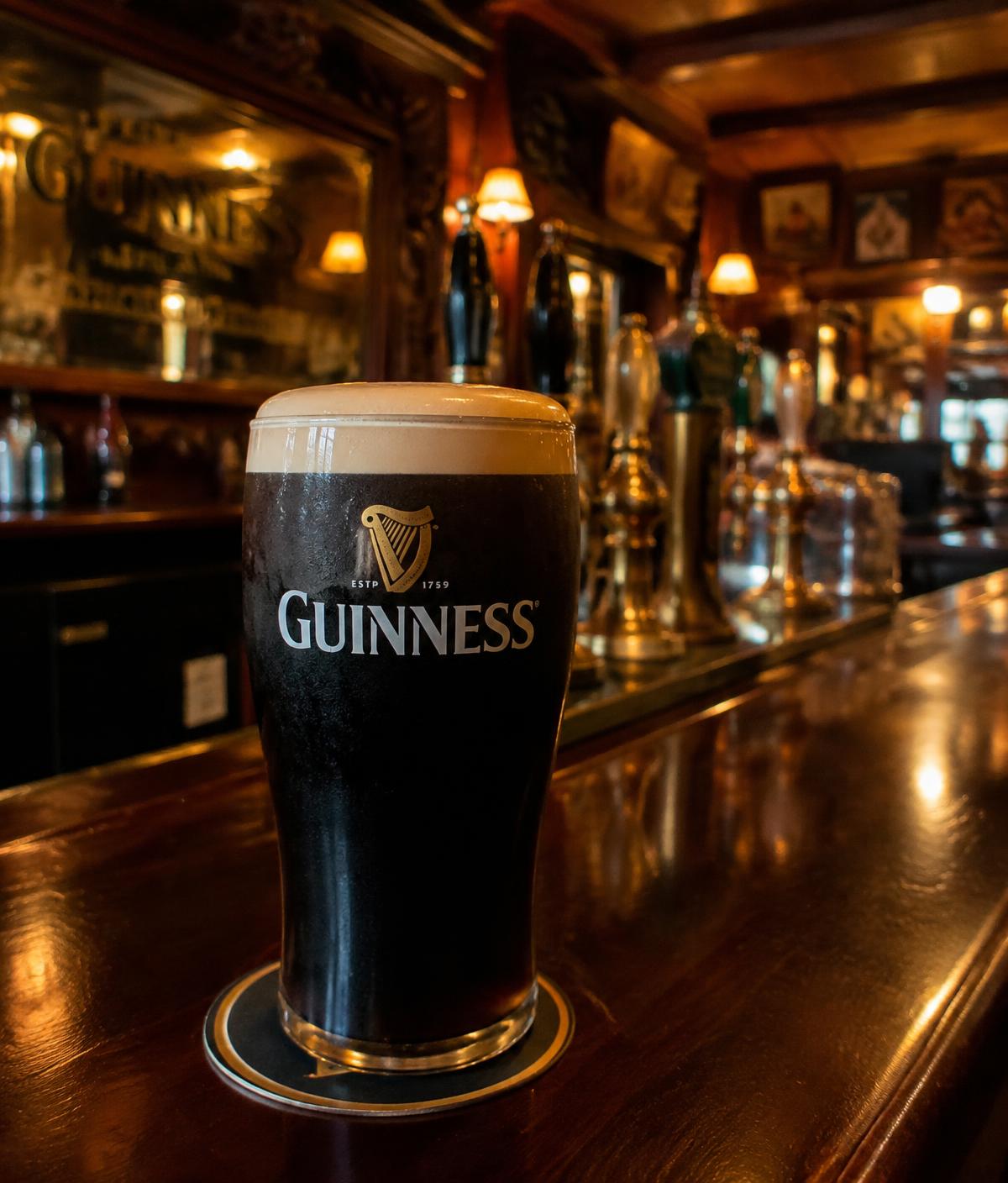A freshly poured pint of stout on the timber bar